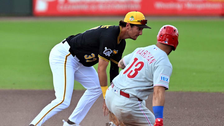 Mar 6, 2026; Bradenton, Florida, USA; Philadelphia Phillies catcher Rafael Marchan (13) slides as Pittsburgh Pirates short stop Alika Williams (37) waits for the ball in the fourth inning during spring training at LECOM Park. Mandatory Credit: Jonathan Dyer-Imagn Images Mar 6, 2026; Bradenton, Florida, USA; Philadelphia Phillies catcher Rafael Marchan (13) slides as Pittsburgh Pirates short stop Alika Williams (37) waits for the ball in the fourth inning during spring training at LECOM Park. Mandatory Credit: Jonathan Dyer-Imagn Images
