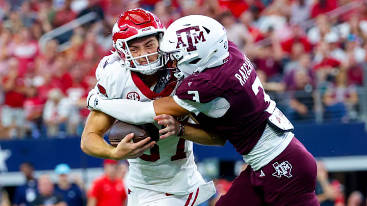 Sep 28, 2024; Arlington, Texas, USA; Arkansas Razorbacks punter Devin Bale (37) attempts a fake punt as Texas A&M Aggies defensive back Marcus Ratcliffe (3) makes the tackle during the second half at AT&T Stadium. Mandatory Credit: Kevin Jairaj-Imagn Images Sep 28, 2024; Arlington, Texas, USA; Arkansas Razorbacks punter Devin Bale (37) attempts a fake punt as Texas A&M Aggies defensive back Marcus Ratcliffe (3) makes the tackle during the second half at AT&T Stadium. Mandatory Credit: Kevin Jairaj-Imagn Images