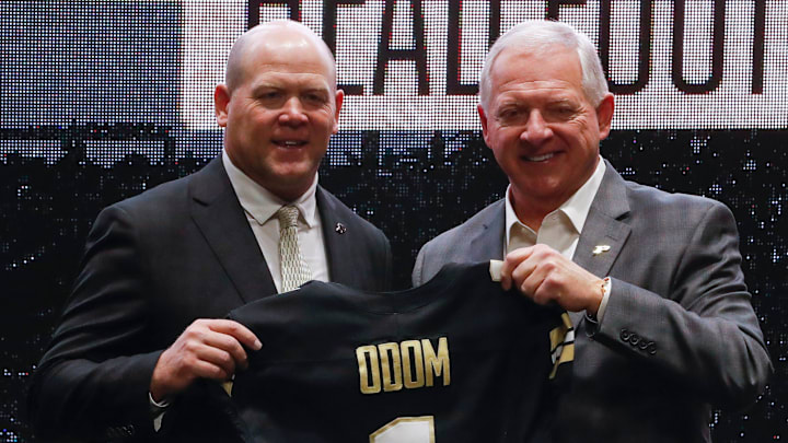 Purdue football head coach Barry Odom and Purdue athletic director Mike Bobinski pose for a photo Purdue football head coach Barry Odom and Purdue athletic director Mike Bobinski pose for a photo