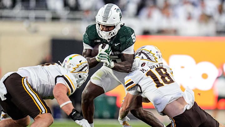 Michigan State running back Makhi Frazier (5) runs against Western Michigan safety Micah Davis (18) during the first half at Spartan Stadium in East Lansing on Friday, August 29, 2025.