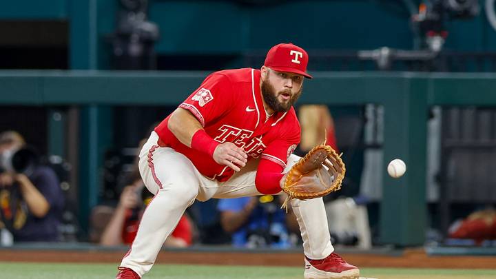 Jul 24, 2026; Arlington, Texas, USA; Texas Rangers first baseman Jake Burger (21) fields a throw during the first inning against the Seattle Mariners at Globe Life Field. Mandatory Credit: Andrew Dieb-Imagn Images Jul 24, 2026; Arlington, Texas, USA; Texas Rangers first baseman Jake Burger (21) fields a throw during the first inning against the Seattle Mariners at Globe Life Field. Mandatory Credit: Andrew Dieb-Imagn Images
