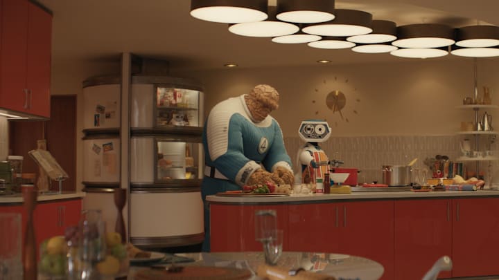 (L-R) Ebon Moss-Bachrach as Ben Grimm/The Thing and H.E.R.B.I.E in 20th Century Studios/Marvel Studios' FANTASTIC FOUR: FIRST STEPS. Photo courtesy of 20th Century Studios/Marvel Studios. © 2025 20th Century Studios / © and ™ 2025 MARVEL.