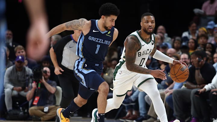 Oct 31, 2024; Memphis, Tennessee, USA; Milwaukee Bucks guard Damian Lillard (0) dribbles as Memphis Grizzlies guard Scotty Pippen Jr. (1) defends during the first half at FedExForum. Mandatory Credit: Petre Thomas-Imagn Images