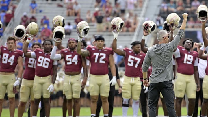 Sep 14, 2024; Tallahassee, Florida, USA; Florida State Seminoles head coach Mike Norvell leads his team before a game against the Memphis Tigers at Doak S. Campbell Stadium. Mandatory Credit: Melina Myers-Imagn Images