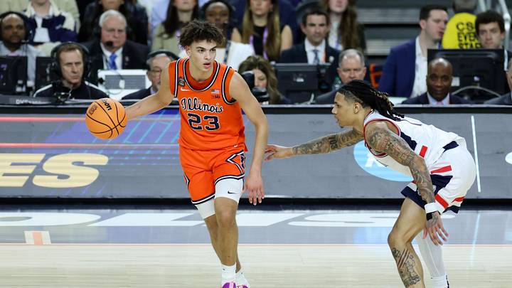 Apr 4, 2026; Indianapolis, IN, USA; Illinois Fighting Illini guard Keaton Wagler (23) dribbles the ball against UConn Huskies guard Solo Ball (1) in the first half during a semifinal of the Final Four of the men's 2026 NCAA Tournament at Lucas Oil Stadium. Mandatory Credit: Trevor Ruszkowski-Imagn Images Apr 4, 2026; Indianapolis, IN, USA; Illinois Fighting Illini guard Keaton Wagler (23) dribbles the ball against UConn Huskies guard Solo Ball (1) in the first half during a semifinal of the Final Four of the men's 2026 NCAA Tournament at Lucas Oil Stadium. Mandatory Credit: Trevor Ruszkowski-Imagn Images