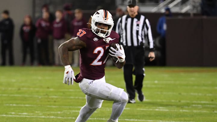 Oct 24, 2025; Blacksburg, Virginia, USA;  Virginia Tech Hokies running back Marcellous Hawkins (27) runs the ball against the California Golden Bears during the first quarter at Lane Stadium. Mandatory Credit: Brian Bishop-Imagn Images