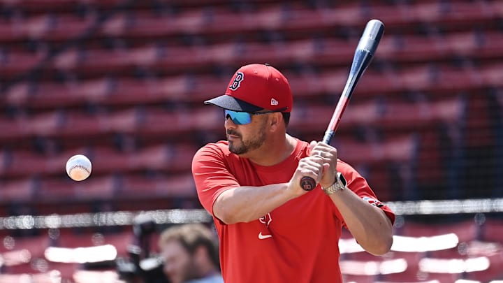 Aug 11, 2024; Boston, Massachusetts, USA; Boston Red Sox bench coach Ramon Vazquez (60) warms up the team before a game against the Houston Astros at Fenway Park. Mandatory Credit: Eric Canha-Imagn Images