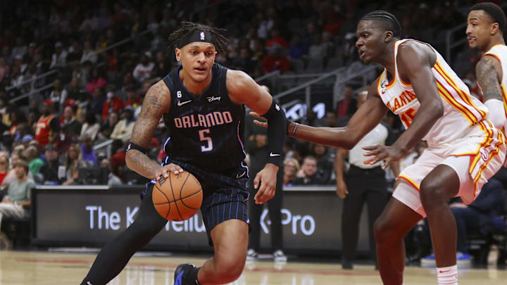 Orlando Magic forward Paolo Banchero (5) dribbles the ball.