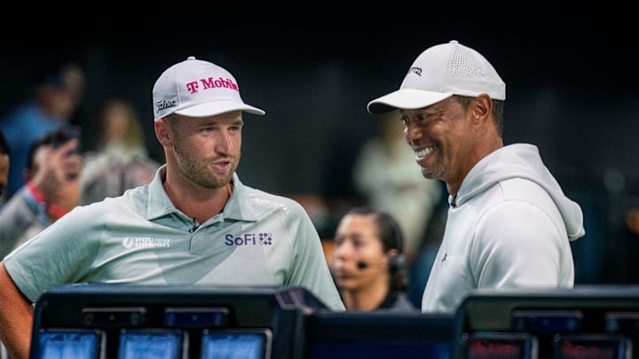 The Bay Club's Wyndham Clark and Tiger Woods talk before the match at SoFi Center, the home of TGL, the interactive golf league founded by Tiger Woods and Rory McIlroy on January 7, 2025 in Palm Beach Gardens, Florida. The Bay Club's Wyndham Clark and Tiger Woods talk before the match at SoFi Center, the home of TGL, the interactive golf league founded by Tiger Woods and Rory McIlroy on January 7, 2025 in Palm Beach Gardens, Florida.