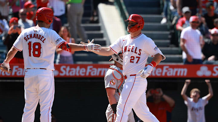 Apr 24, 2024; Anaheim, California, USA;  Los Angeles Angels designated hitter Mike Trout (27) is greeted by first base Nolan Schanuel (18) after hitting a home run during the sixth inning against the Baltimore Orioles at Angel Stadium. Mandatory Credit: Kiyoshi Mio-Imagn Images