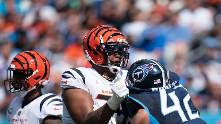 Cincinnati Bengals offensive tackle Orlando Brown Jr. (75) and Tennessee Titans linebacker Caleb Cincinnati Bengals offensive tackle Orlando Brown Jr. (75) and Tennessee Titans linebacker Caleb