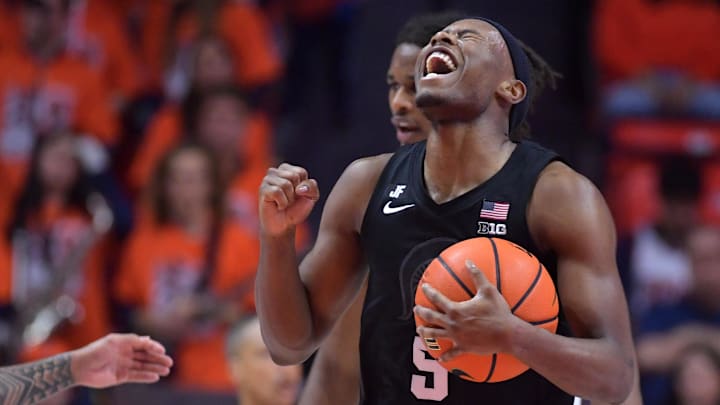 Feb 15, 2025; Champaign, Illinois, USA;  Michigan State Spartans guard Tre Holloman (5) reacts after a win over the Illinois Fighting Illini at State Farm Center. Mandatory Credit: Ron Johnson-Imagn Images