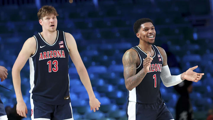 Nov 27, 2024; Paradise Island, Bahamas, BHS; Arizona Wildcats guard Caleb Love (1) reacts with Arizona Wildcats forward Henri Veesaar (13) during the second half against the Davidson Wildcats at the Atlantis Resort.  Mandatory Credit: Kevin Jairaj-Imagn Images