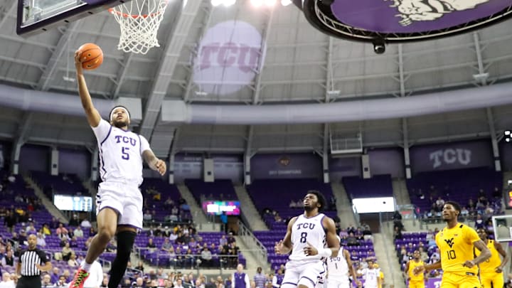 Micah Robinson Layup, with Ernest Udeh Jr. following close behind Micah Robinson Layup, with Ernest Udeh Jr. following close behind