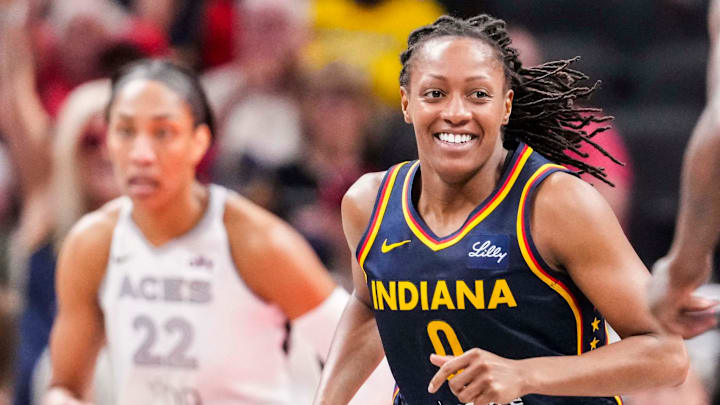 Indiana Fever guard Kelsey Mitchell (0) smiles after a play Thursday, July 3, 2025, during a game between the Indiana Fever and the Las Vegas Aces at Gainbridge Fieldhouse in Indianapolis. Indiana Fever guard Kelsey Mitchell (0) smiles after a play Thursday, July 3, 2025, during a game between the Indiana Fever and the Las Vegas Aces at Gainbridge Fieldhouse in Indianapolis.