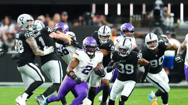 Dec 10, 2023; Paradise, Nevada, USA; Minnesota Vikings running back Alexander Mattison (2) gains yardage against the Las Vegas Raiders during the second quarter at Allegiant Stadium. Mandatory Credit: Stephen R. Sylvanie-USA TODAY Sports