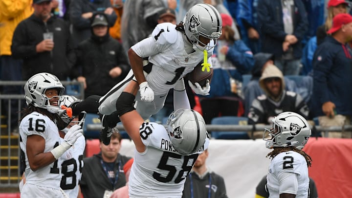 Sep 7, 2025; Foxborough, Massachusetts, USA; Las Vegas Raiders wide receiver Tre Tucker (1) reacts after scoring a touchdown against the New England Patriots during the first quarter at Gillette Stadium. Mandatory Credit: Bob DeChiara-Imagn Images