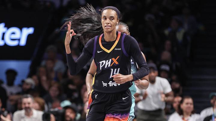Jul 25, 2025; Brooklyn, New York, USA;  Phoenix Mercury forward DeWanna Bonner (14) gestures after making a three-point shot in the second quarter against the New York Liberty at Barclays Center. Mandatory Credit: Wendell Cruz-Imagn Images
