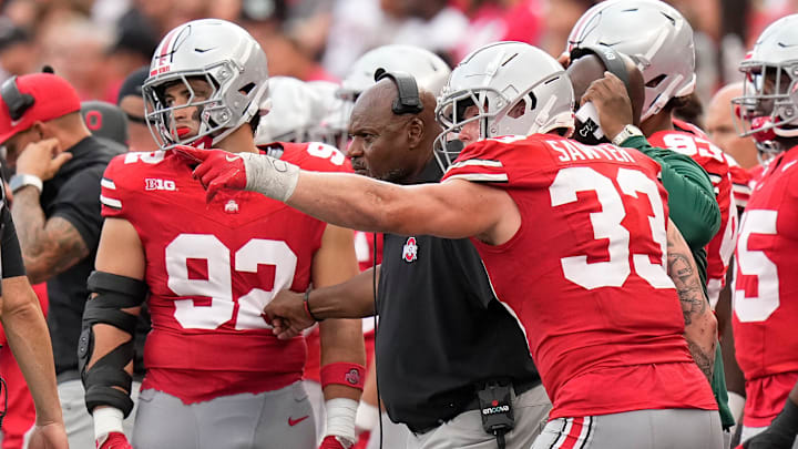 Aug 31, 2024; Columbus, OH, USA; Ohio State Buckeyes defensive end Jack Sawyer (33) points out a play to coach Larry Johnson during the second half of the NCAA football game against the Akron Zips at Ohio Stadium. Ohio State won 52-6.