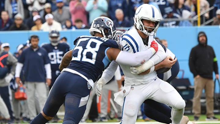 Dec 3, 2023; Nashville, Tennessee, USA; Tennessee Titans linebacker Harold Landry III (58) and linebacker Arden Key (49) combine for a sack on Indianapolis Colts quarterback Gardner Minshew (10) during the second half at Nissan Stadium. 