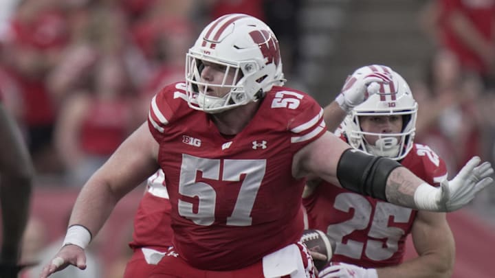 Oct 18, 2025; Madison, Wisconsin, USA;  Wisconsin Badgers offensive lineman Jake Renfro (57) provides pass protection during the fourth quarter of their game against Ohio State at Camp Randall Stadium.