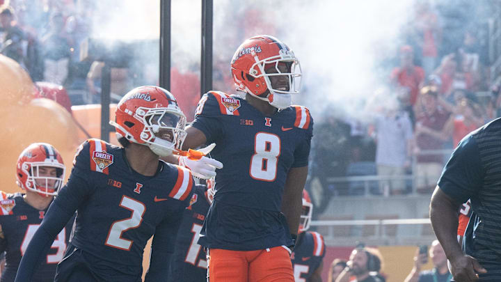Dec 31, 2024; Orlando, FL, USA; Illinois Fighting Illini wide receiver Malik Elzy (8) and Illinois Fighting Illini wide receiver Ashton Hollins (2) lead the team out of the tunnel before the game against the South Carolina Gamecocks at Camping World Stadium. Mandatory Credit: Jeremy Reper-Imagn Images