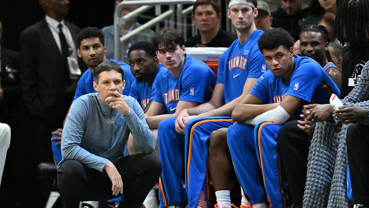 Oct 14, 2025; Milwaukee, Wisconsin, USA; Oklahoma City Thunder Head Coach Mark Daigneault watches his team against the Milwaukee Bucks during the first half at Fiserv Forum. Mandatory Credit: Patrick Gorski-Imagn Images Oct 14, 2025; Milwaukee, Wisconsin, USA; Oklahoma City Thunder Head Coach Mark Daigneault watches his team against the Milwaukee Bucks during the first half at Fiserv Forum. Mandatory Credit: Patrick Gorski-Imagn Images