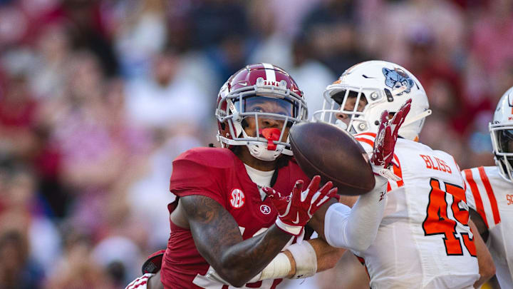 Nov 16, 2024; Tuscaloosa, Alabama, USA; Alabama Crimson Tide wide receiver Jaren Hamilton (16) reaches out for the ball against Mercer Bears safety Tommy Bliss (45) during the fourth quarter at Bryant-Denny Stadium. Mandatory Credit: Will McLelland-Imagn Images