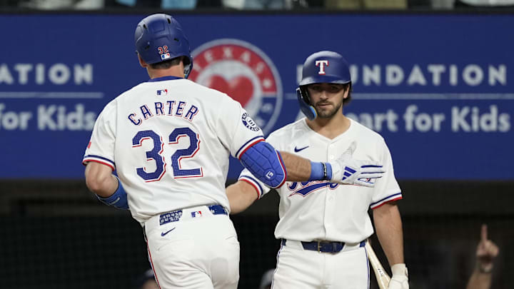 Apr 24, 2024; Arlington, Texas, USA; Texas Rangers left fielder Evan Carter (32) celebrates his home Apr 24, 2024; Arlington, Texas, USA; Texas Rangers left fielder Evan Carter (32) celebrates his home