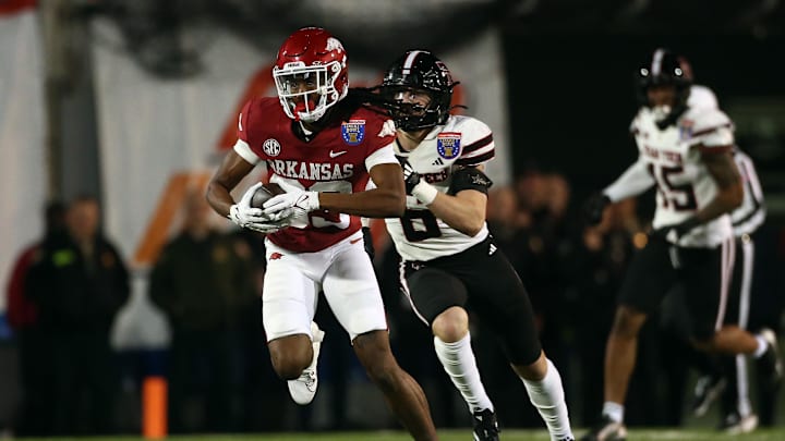 Dec 27, 2024; Memphis, TN, USA; Arkansas Razorbacks wide receiver Dazmin James (83) runs after a catch during the second quarter against the Texas Tech Red Raiders at Simmons Bank Liberty Stadium. Mandatory Credit: Petre Thomas-Imagn Images