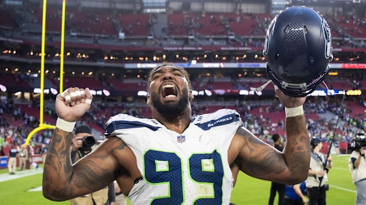 Dec 8, 2024; Glendale, Arizona, USA; Seattle Seahawks defensive end Leonard Williams (99) celebrates after defeating the Arizona Cardinals at State Farm Stadium. Mandatory Credit: Mark J. Rebilas-Imagn Images