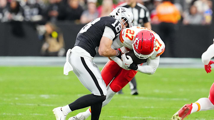 Jan 4, 2026; Paradise, Nevada, USA; Kansas City Chiefs safety Chamarri Conner (27) intercepts a pass intended for Las Vegas Raiders wide receiver Jack Bech (18) during the first quarter at Allegiant Stadium. Mandatory Credit: Stephen R. Sylvanie-Imagn Images