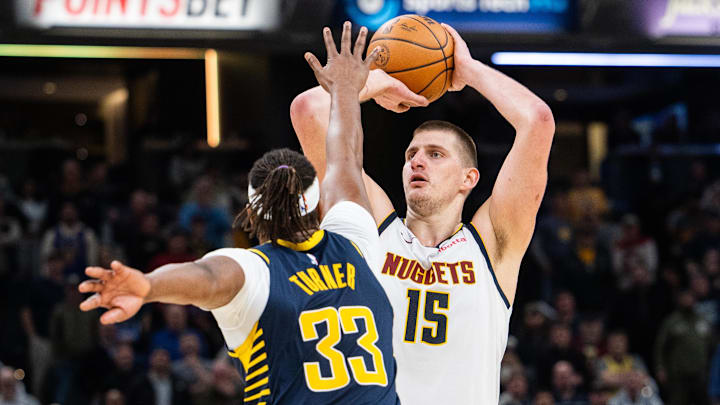  Denver Nuggets center Nikola Jokic (15) shoots the ball while Indiana Pacers center Myles Turner (33) defends in the second half at Gainbridge Fieldhouse. Mandatory Credit: Trevor Ruszkowski-Imagn Images