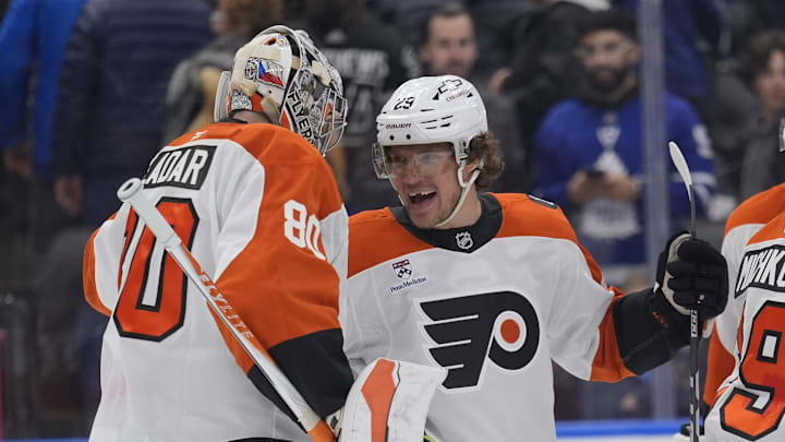 Mar 2, 2026; Toronto, Ontario, CAN; Philadelphia Flyers forward Nikita Grebenkin (29) and goaltender Dan Vladar (80) celebrate a win over the Toronto Maple Leafs in an overtime shoot out at Scotiabank Arena.
