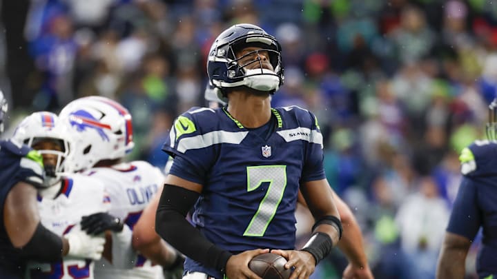 Oct 27, 2024; Seattle, Washington, USA; Seattle Seahawks quarterback Geno Smith (7) reacts after a delay of game penalty following a fourth quarter timeout against the Buffalo Bills at Lumen Field. Mandatory Credit: Joe Nicholson-Imagn Images
