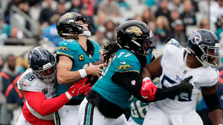 Jan 4, 2026; Jacksonville, Florida, USA; Tennessee Titans defensive tackle Jeffery Simmons (98) sacks Jacksonville Jaguars quarterback Trevor Lawrence (16) during the first quarter at EverBank Stadium. Mandatory Credit: Travis Register-Imagn Images Jan 4, 2026; Jacksonville, Florida, USA; Tennessee Titans defensive tackle Jeffery Simmons (98) sacks Jacksonville Jaguars quarterback Trevor Lawrence (16) during the first quarter at EverBank Stadium. Mandatory Credit: Travis Register-Imagn Images