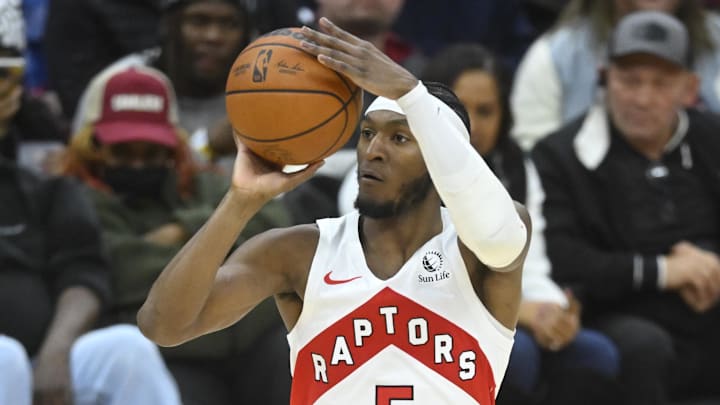 Jan 9, 2025; Cleveland, Ohio, USA; Toronto Raptors guard Immanuel Quickley (5) shoots a three-point shot in the fourth quarter against the Cleveland Cavaliers at Rocket Mortgage FieldHouse. Mandatory Credit: David Richard-Imagn Images