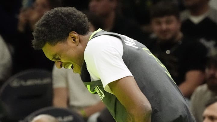 Nov 14, 2025; Minneapolis, Minnesota, USA; Minnesota Timberwolves forward Jaden McDaniels (3) reacts after getting hit in the face by a member of the Sacramento Kings in the first quarter at Target Center. Mandatory Credit: Bruce Kluckhohn-Imagn Images