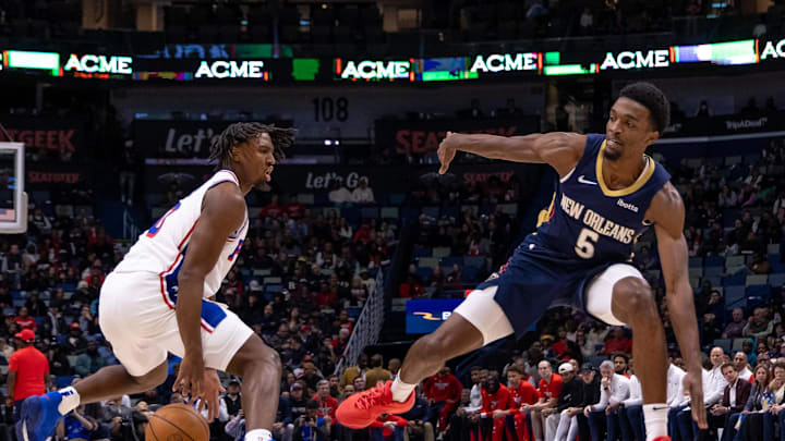 Nov 29, 2023; New Orleans, Louisiana, USA; Philadelphia 76ers guard Tyrese Maxey (0) dribbles against New Orleans Pelicans forward Herbert Jones (5) during the first half at the Smoothie King Center. Mandatory Credit: Stephen Lew-Imagn Images