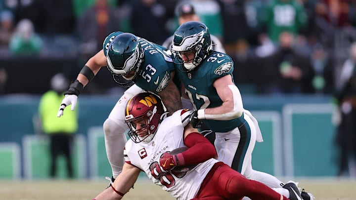 Jan 26, 2025; Philadelphia, PA, USA; Philadelphia Eagles linebacker Zack Baun (53) and safety Reed Blankenship (32) tackle Washington Commanders tight end Zach Ertz (86) during the first half in the NFC Championship game at Lincoln Financial Field. Mandatory Credit: Bill Streicher-Imagn Images