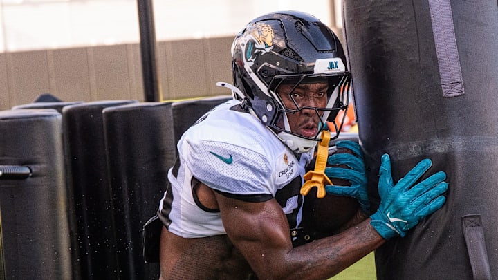 Jacksonville Jaguars running back LeQuint Allen Jr. (36) runs through a gauntlet during the Jaguars 14th NFL training camp session at Miller Electric Center Tuesday August 12, 2025 in Jacksonville, Fla. The Jaguars travel to New Orleans to play the Saints this Sunday in their second preseason game. [Doug Engle/Florida Times-Union]