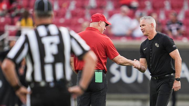 Louisville Cardinals head coach Jeff Brohm greets Florida State Seminoles head coach Mike Norvell before ACC college football at L&N Stadium in Louisville, Kentucky. Oct. 9, 2026.