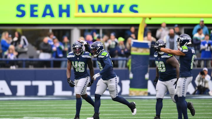 Nov 24, 2024; Seattle, Washington, USA; Seattle Seahawks linebacker Tyrice Knight (48) celebrates after sacking Arizona Cardinals quarterback Kyler Murray (1) (not pictured) during the first half at Lumen Field. 