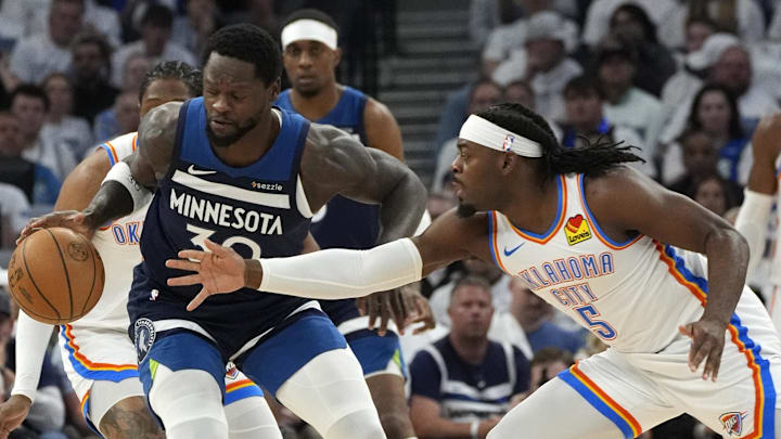 May 26, 2025; Minneapolis, Minnesota, USA; Minnesota Timberwolves forward Julius Randle (30) dribbles the ball against Oklahoma City Thunder guard Luguentz Dort (5) in the first half in game four of the western conference finals for the 2025 NBA Playoffs at Target Center. Mandatory Credit: Bruce Kluckhohn-Imagn Images May 26, 2025; Minneapolis, Minnesota, USA; Minnesota Timberwolves forward Julius Randle (30) dribbles the ball against Oklahoma City Thunder guard Luguentz Dort (5) in the first half in game four of the western conference finals for the 2025 NBA Playoffs at Target Center. Mandatory Credit: Bruce Kluckhohn-Imagn Images