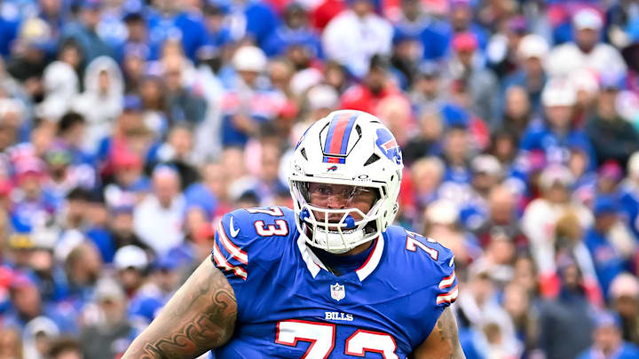 Buffalo Bills offensive tackle Dion Dawkins looks to make a block down field against the Miami Dolphins in the third quarter at Highmark Stadium.
