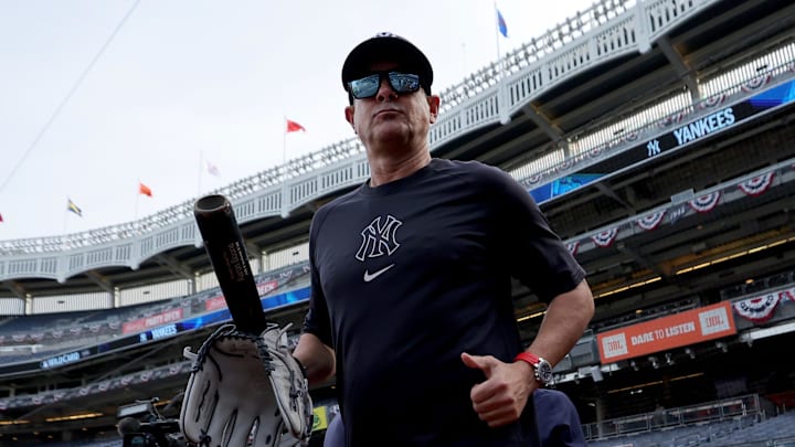 Sep 30, 2025; Bronx, New York, USA; New York Yankees manager Aaron Boone (17) watches batting practice before game one of the Wildcard round of the 2025 MLB playoffs against the Boston Red Sox at Yankee Stadium. Mandatory Credit: Brad Penner-Imagn Images