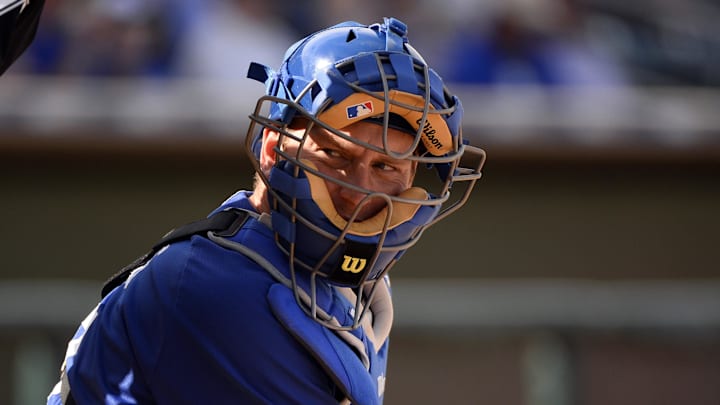 Los Angeles Dodgers catcher AJ Ellis (17) looks over for a sign during the sixth inning against the Kansas City Royals at Surprise Stadium. 