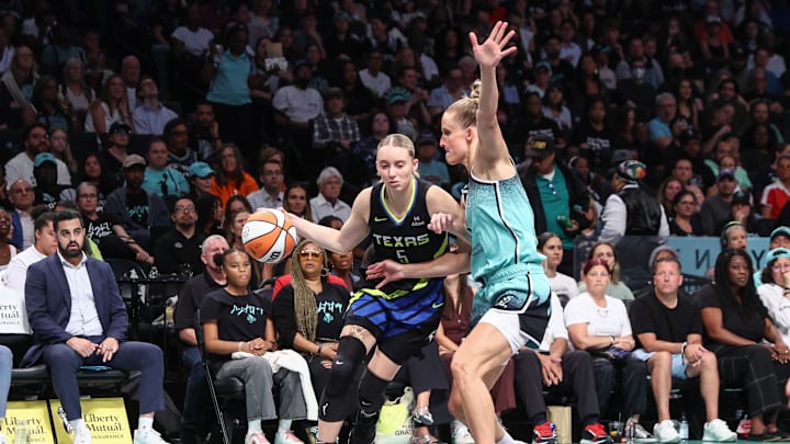 Aug 5, 2025; Brooklyn, New York, USA;  Dallas Wings guard Paige Bueckers (5) looks to drive past New York Liberty forward Leonie Fiebich (13) in the second quarter at Barclays Center. Mandatory Credit: Wendell Cruz-Imagn Images