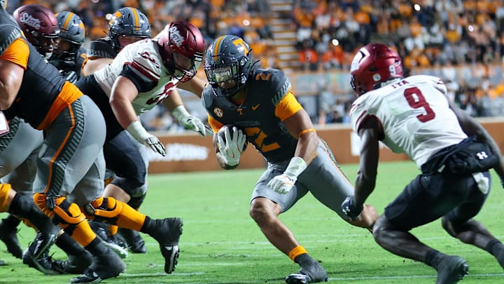 Nov 15, 2025; Knoxville, Tennessee, USA;  Tennessee Volunteers running back Peyton Lewis (2) runs the ball against the New Mexico State Aggies during the second half at Neyland Stadium. Mandatory Credit: Randy Sartin-Imagn Images