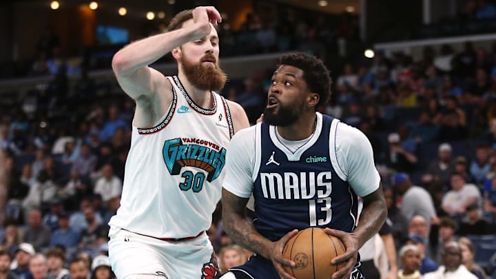 Apr 13, 2025; Memphis, Tennessee, USA; Dallas Mavericks forward Naji Marshall (13) drives to the basket as Memphis Grizzlies center Jay Huff (30) defends during the first quarter at FedExForum. Mandatory Credit: Petre Thomas-Imagn Images Apr 13, 2025; Memphis, Tennessee, USA; Dallas Mavericks forward Naji Marshall (13) drives to the basket as Memphis Grizzlies center Jay Huff (30) defends during the first quarter at FedExForum. Mandatory Credit: Petre Thomas-Imagn Images